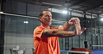 Padel, tennis and man on court stretching for training, match and practice game in sports club. Fitness, exercise and mature person with warm up for challenge, tournament and competition for hobby