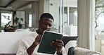 Planning, tablet and black man in home with research for education, learning or college application. Ideas, thinking and African male person with digital technology for student loan in apartment.