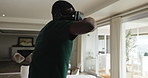 Fighting, vr headset and black man in home for video game, entertainment or metaverse in living room. Goggles, technology and African male person with simulation for esports gaming in apartment.