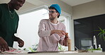 Seasoning, man and person in kitchen with spices, together and food aroma for dinner preparations. Supper, stove and people at house with happy friend, tasty ingredients or recipes for home made meal