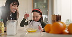 Mom, child or whisk with bowl in kitchen for dessert or teaching culinary art in home. Mother, daughter or helping junior baker with mixing eggs or batter for recipe or meal prep together in house