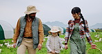 Parents, child and walk at chicken farm for agriculture, learning or holding hands with happy family. Poultry farmer, mother and father with girl to talk of livestock, care or production with basket