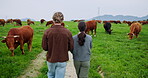 Cow, farm and back with people in nature for herd manager, breeding specialist and agriculture. Cattle reproduction expert, sustainability and animal stock review with farmers on countryside field
