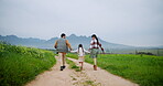 Farmer, holding hands and back of family on countryside field for support, bonding or agriculture. Environment, connection and love with parents and child on nature path for sustainability and growth