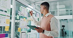 Tablet, business man or writing on sticky note for UI development, app layout or plan on glass wall. UX designer, technology or board for interface, schedule or solution for user experience in office