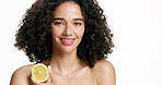 Happy woman, face and skincare with lemon for vitamin C nutrition on a white studio background. Portrait, female person or model with smile or natural organic citrus fruit for antioxidant on space