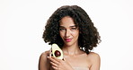 Woman, face and skincare with avocado for diet or antioxidant on a white studio background. Portrait, female person or model with natural organic fruit or pit for health, fiber or vitamins on space