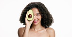 Happy woman, face and avocado with skincare in studio for skin nutrition on a white background. Portrait, female person or model with smile or natural organic fruit for health, vitamin or antioxidant