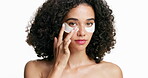 Skincare, face and girl with eye patches in studio for dark circles, hydration treatment or self care. Dermatology, woman or apply mask for anti aging, skin glow or beauty routine on white background