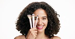 Beauty, makeup or woman in studio with brush, coverage or blending in self care. Portrait, facial or beautician on white background with cosmetic tools, natural or flawless application for glow.