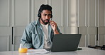 Headset, laptop and remote work with man in home kitchen for customer service or support. Computer, contact and feedback with freelance employee in apartment for assistance, consulting or help