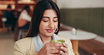 Drinking, matcha and happy woman in cafe for peaceful morning, contemplating or relax on weekend. Reflection, thoughtful and female person in shop with hot beverage for breakfast, wellness and break.