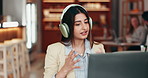 Woman, video call and headphones at cafe with talk, business consulting and laptop for remote work. Person, agent and freelance advisor with virtual meeting, computer and discussion at coffee shop
