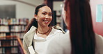 Woman, university student and friends at library, talk or smile with literature for project at academy. Girl, people and happy for chat with research, education or learning for scholarship at college