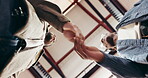 Friends, men and greeting for secret handshake, bonding and reunion with friendly gesture or talking. Low angle, people and shaking hands on weekend, conversation and agreement on break or hangout