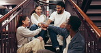 Happy people, students and stairs with hands together in library for teamwork, mission or support. Excited, study group or academic learners with pile or stack on staircase for unity in bookstore