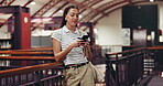 Woman, texting and smile in library with phone, scrolling and notification for university email. Happy student, person or typing in school study with mobile, education or good news for online app