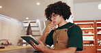 Thinking, scroll and man at restaurant with tablet, menu development and planning for small business. Research food trend, tech and entrepreneur in kitchen, recipe creation and culinary innovation.
