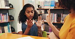 Child, woman and help to count on hands in library with tutor, education and learning maths. Girl, african person and writing on paper for teaching, support or problem solving and homework for school