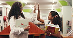 Library, teacher and high five with kid for learning, support and development. Girl, happy student and celebration with educator for education achievement, success and talk with books for knowledge