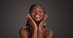 Face, skincare and happy black woman in studio for dermatology results, lipstick or glow. Cosmetics, self care and model touch skin, beauty makeup or cosmetology benefits on dark background space