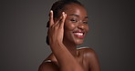 Face, cosmetics and black woman in studio, smile and dermatology on dark background. African person, space and happy with wellness, skincare or grooming with treatment and beauty with shine or glow