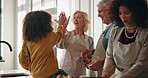 Cooking, high five and thanksgiving with family in kitchen of home together for celebration. Excited, motivation or success with girl and grandmother in apartment for holidays or social gathering