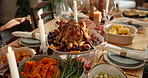 Thanksgiving, gathering and dinner with turkey in dining room for festive holiday, celebration or harvest tradition. Vegetables, gratitude and nutrition with food on table of home for feast and event