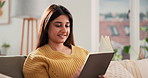 Relax, reading and woman with book on sofa for weekend, rest and comfortable with hobby in home. Happy, living room and person with novel, story and literature for learning, entertainment and fiction