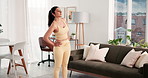 Woman, stretching back and yoga mat for fitness in home, start and ready for exercise routine in lounge. Person, training and wellness with warm up, sportswear and pilates in living room at house
