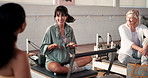 Friends, people and talking in pilates class for fitness, exercise and workout tips for healthy body. Active, women and group in gym with conversation, discussion or communication for wellness goals.
