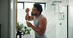 Man, mirror and serum for skincare at house for hydration, collagen benefits and natural beauty. Male person, product and cosmetics for dermatology, hyaluronic acid and treatment shine in bathroom