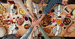 Above, hands stack and family with food, home and celebration with healthy meal. Thanksgiving, group and people with gesture, reunion and festive with tradition, feast and holiday with wine and party