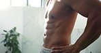 Man, bathroom and muscular body with abs for bodybuilding, fitness or flexing core in home. Closeup, male person or bodybuilder with muscle or masculine physique for health or wellness in house