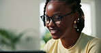 Glasses, laptop and smile of black woman student in living room of home for education or study. Computer, distance learning and scholarship with college or university pupil in apartment for research