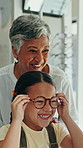 Glasses, optometrist and girl in office, excited and wellness with frames, sight and prescription. Professional, optician and child with eyewear, clear vision or test with spectacles and consultation