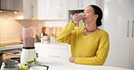 Happy woman, drink and diet with smoothie in kitchen for weight loss, health or wellness in home. Female person, nutritionist or smile with natural organic beverage, blender or milkshake in house