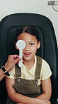 Optometry, eye exam and face of child in clinic with cover for consulting, prescription lens and vision test. Healthcare, optician tools and portrait of girl for prescription lens, glasses and sight