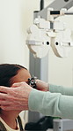 Glasses, optometrist and girl in clinic, help and wellness with frames, clear vision and healthcare. Mature person, optician and child with eyewear, help and test with spectacles and prescription