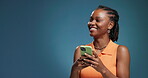 Phone, smile and space with black woman in studio for social media announcement, status update and chat. Happy, online promotion and mockup with person and mobile on blue background for post news