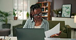 Documents, laptop and remote work with black woman in home office for online planning or research. Computer, paperwork and reading with freelance employee in apartment for small business startup