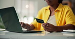 Woman, hands and laptop with credit card for online shopping, remote banking or payment in home. Female person, shopper or debit with computer for ecommerce app, purchase or wireless transaction