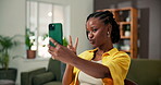Peace sign, selfie and social media with black woman in living room of home for post or update. App, profile picture and pouting with happy African person in apartment for connection or photograph