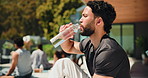 Outdoor, athlete and man with water, break and prevention of dehydration with beverage and nutrition. Drinking, liquid and person with bottle for fitness, thirsty and body regulation with hydration
