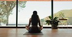 Meditation, woman and wellness in home, yoga and mindfulness on floor, back and calm in living room. Healthy, routine and person on mat for self awareness, zen and sukasana with inner peace benefits