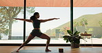 Pilates, woman and stretching with zen in home for mobility, flexibility and core muscle strength. Yoga, balance and warm up for arms, legs and warrior pose for posture with mindfulness or wellness