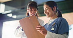 Happy, doctors or women in office with clipboard for research information, review or discussion. Healthcare people or smile in clinic with documents for medical breakthrough, lab results or feedback.