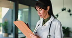 Clipboard, medical and writing with woman doctor in hospital for checklist, insurance or review. Healthcare, notes and paperwork with mature medicine professional in clinic for planning or schedule