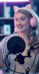 Face, microphone and podcast with woman in bunny ears for content creation or product review. Headphones, live streaming and talk show with happy influencer in studio for advertising or marketing
