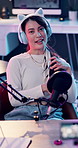 Face, microphone and podcast with woman in headphones for content creation or recording. Bunny ears, live streaming and talk show with happy influencer in studio for radio or subscription service